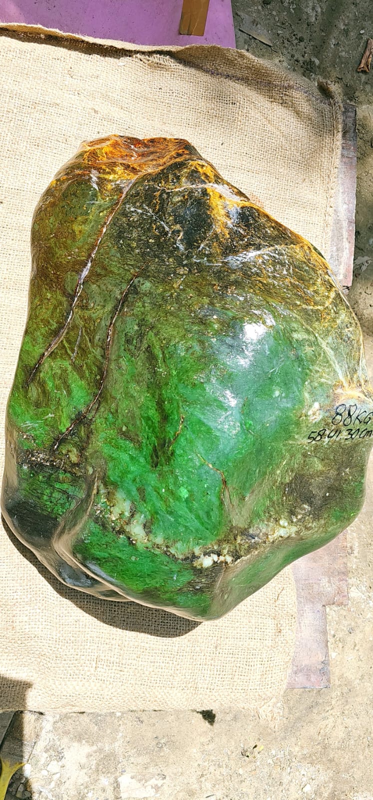 A green gemstone presented as a statement jewelry piece