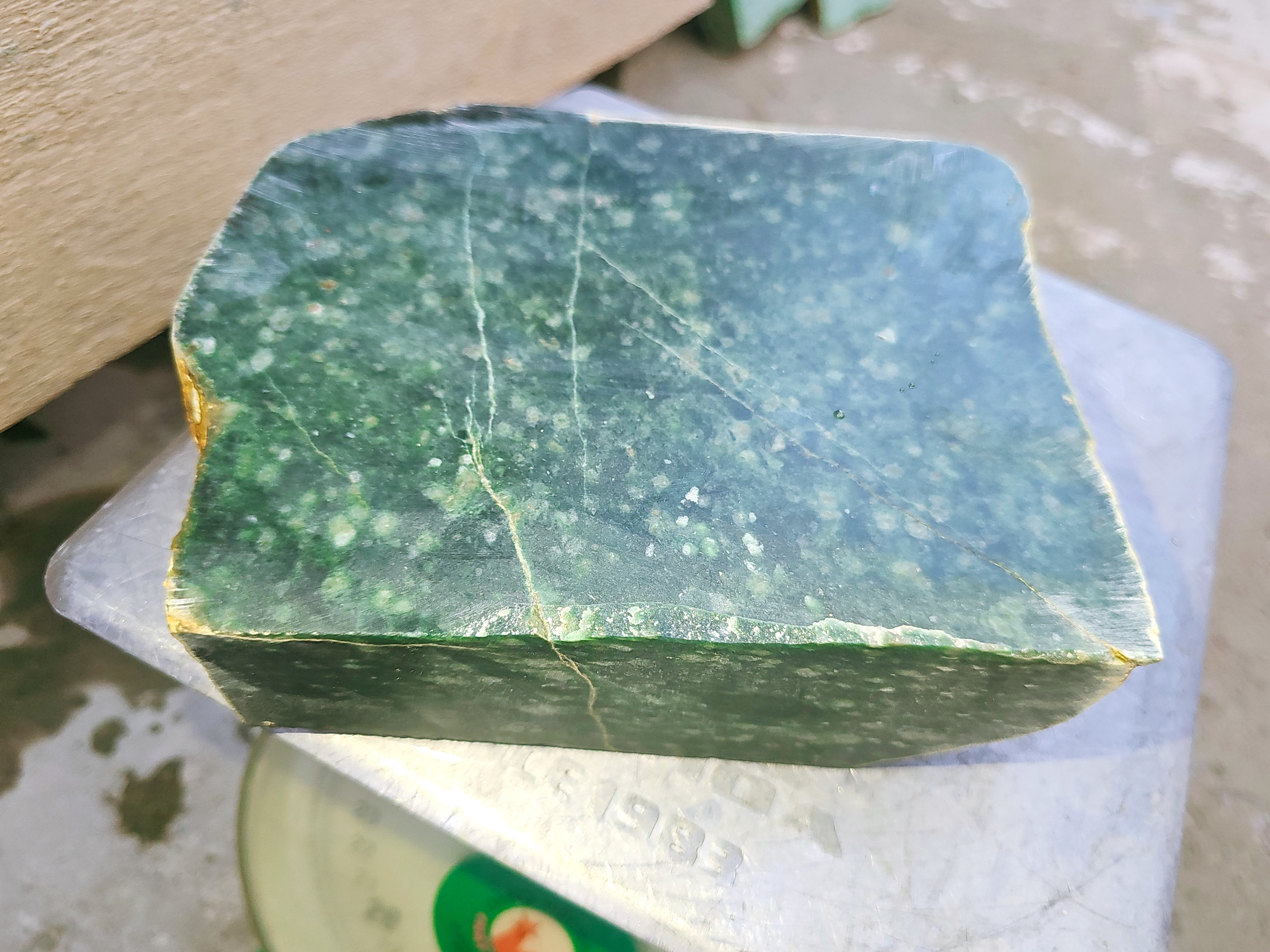 Dark green jadeite jade cutting