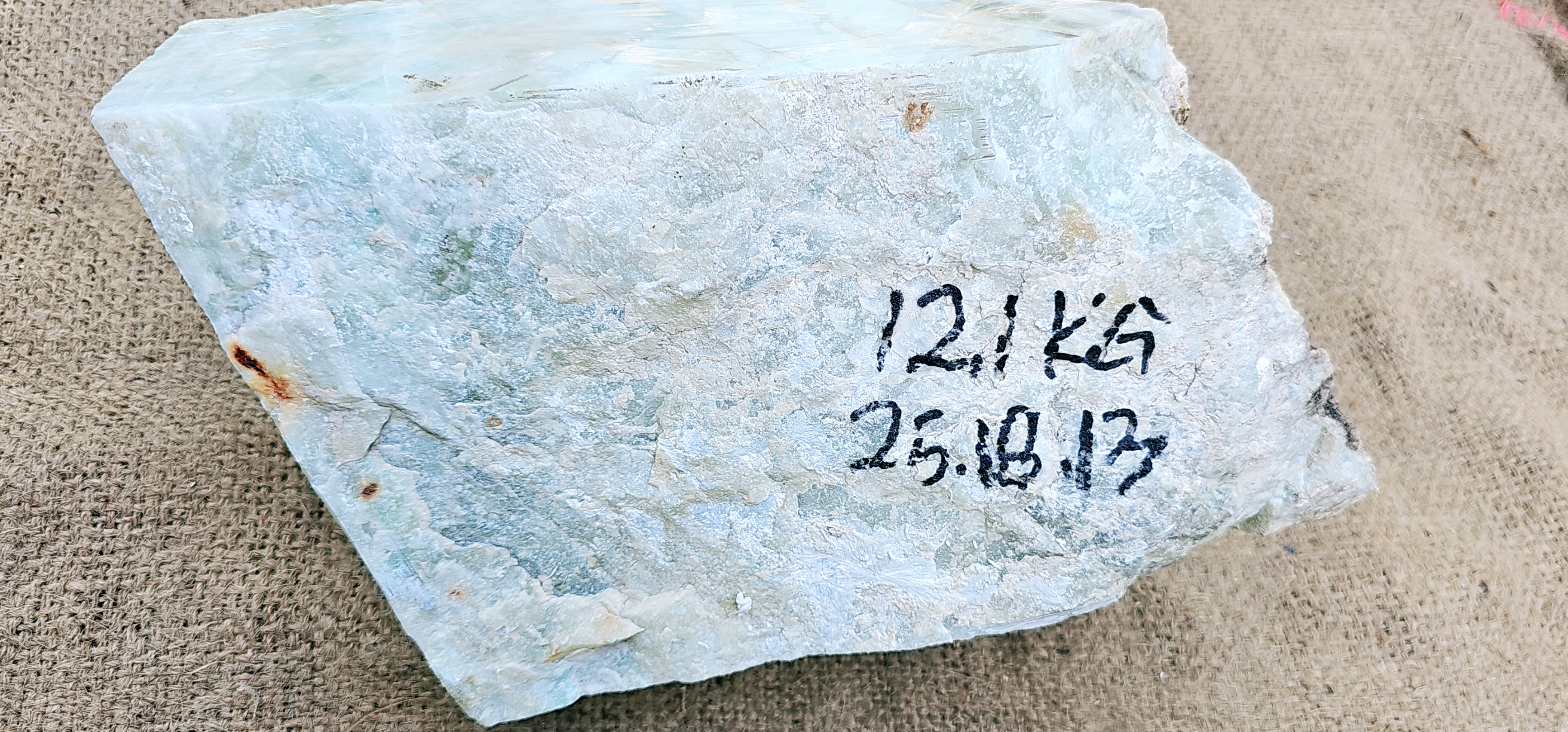 Aceh Ice Jade Rough Stone with Pale Blue-Green Tones and Translucent Crystalline Veining – 12.1 KG
