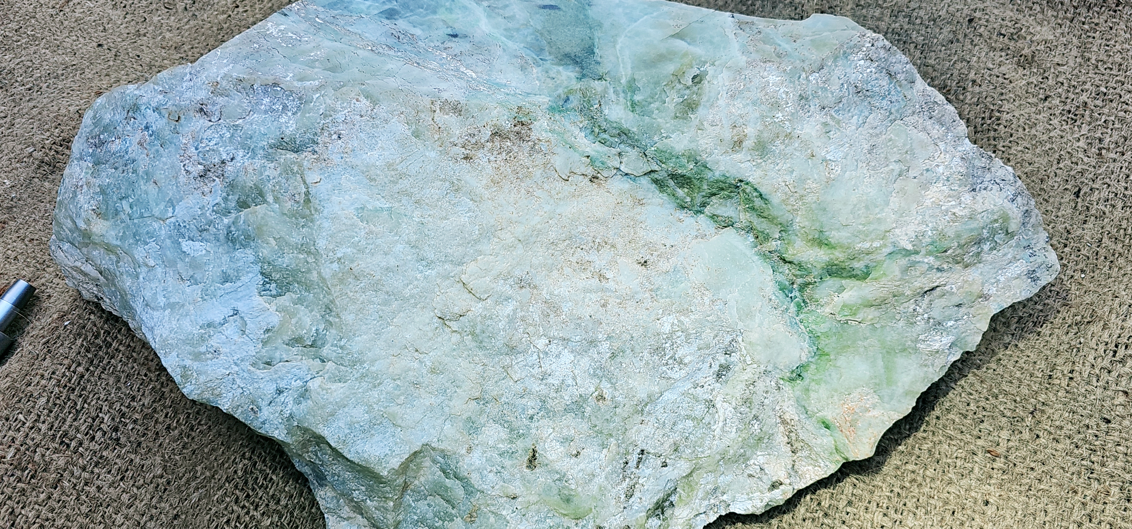 Aceh Natural Moss Green and Creamy White Ice Jade Rough Stone with Dynamic Veined Patterns – 12.1 KG